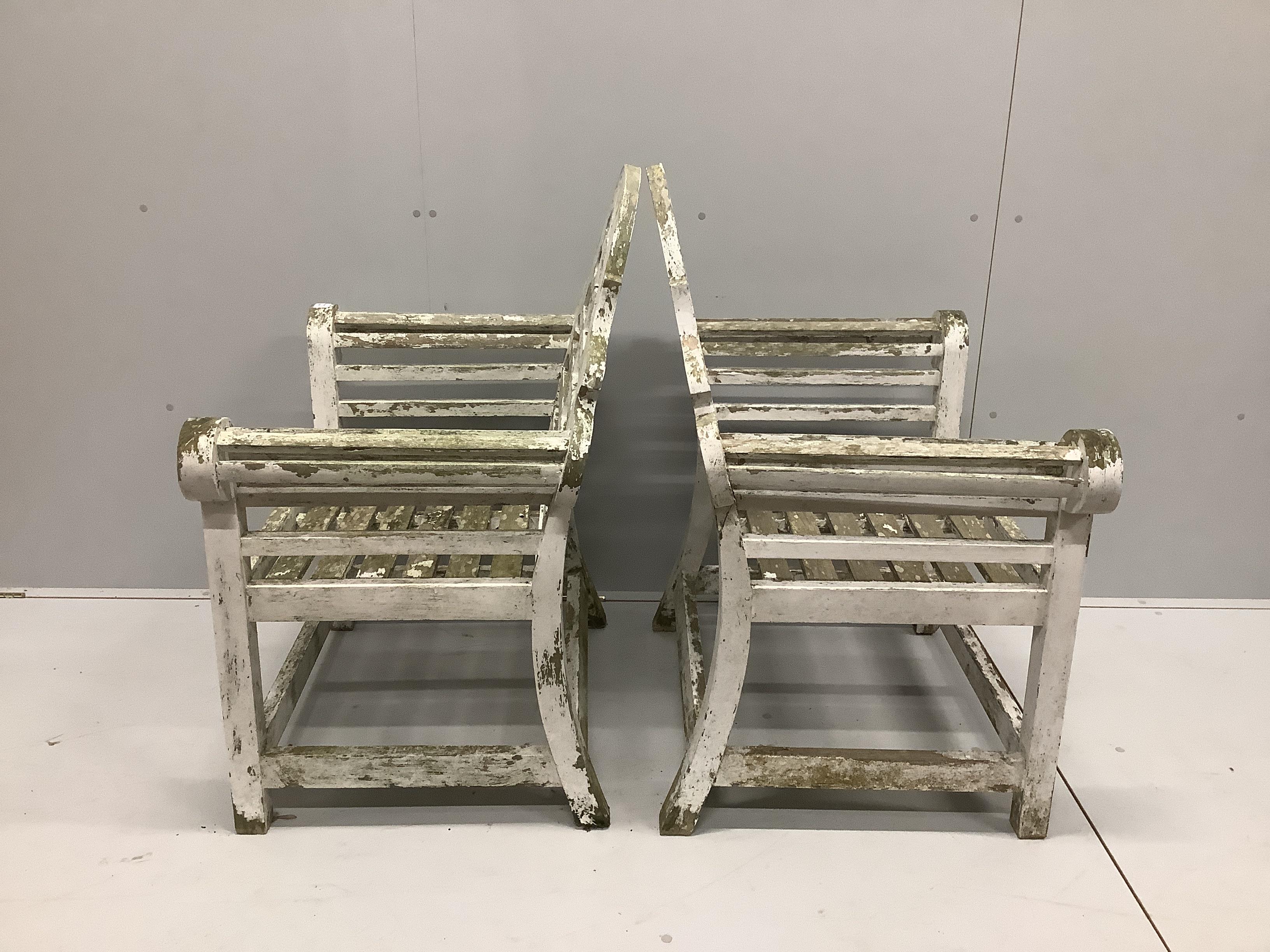 A pair of painted teak Lutyens style garden armchairs, width 90cm, depth 59cm, height 106cm